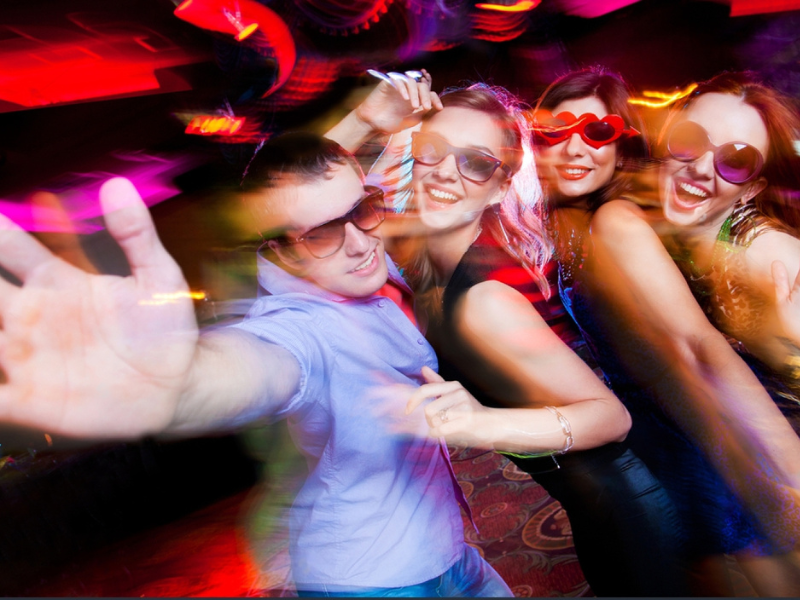 Group of first time swingers enjoying themselves at a swingers club