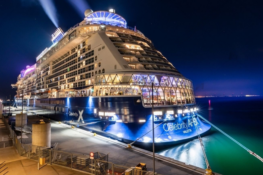 Swinger cruise ship docked at night