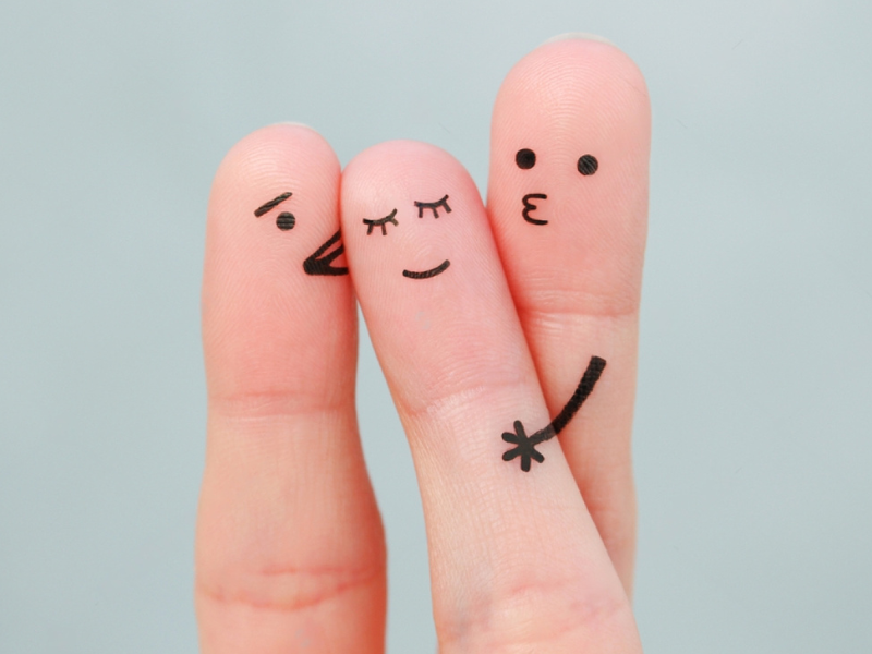 Finger art. Concept boys kiss girl on cheek.